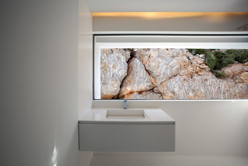 Interior design of a sink and window of the House on the Cliff by Fran Silvestre Arquite