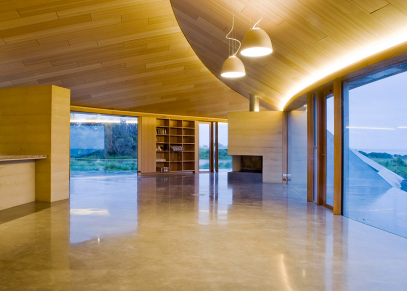 Interior design of a large and empty space with a wooden celing at the Crofthouse by James Stockwell