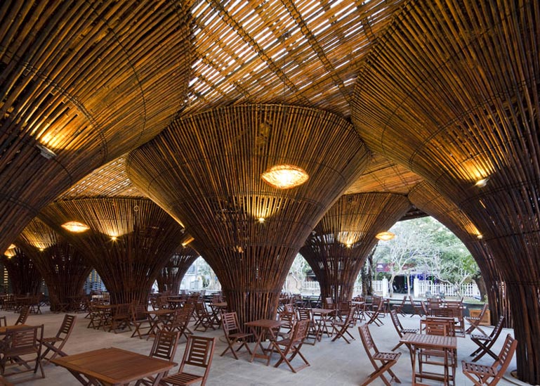 Large bamboo columns at the Kontum Indochine Cafe by Vo Trong Nghia Architects