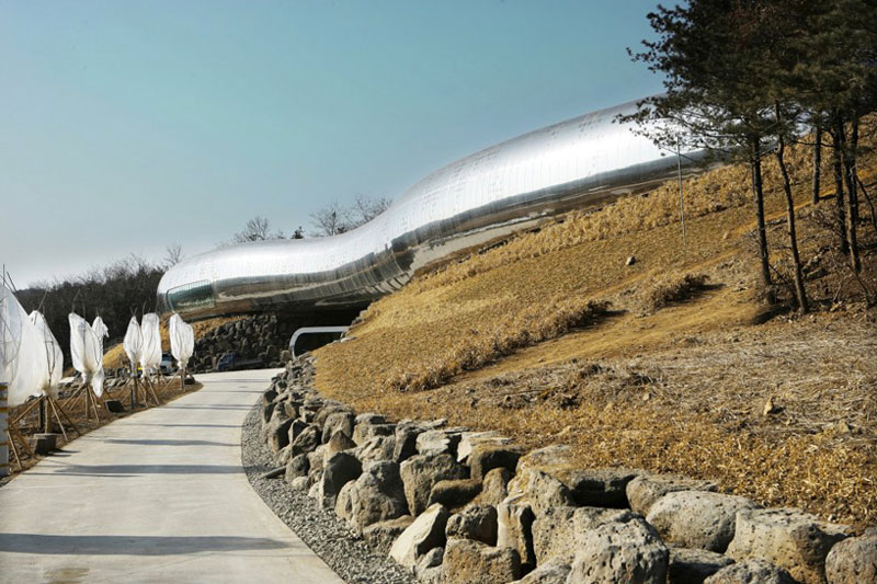 Serpentine architecture of the Jeongok Museum South Korea Prehistory Museum by X-TU Architects