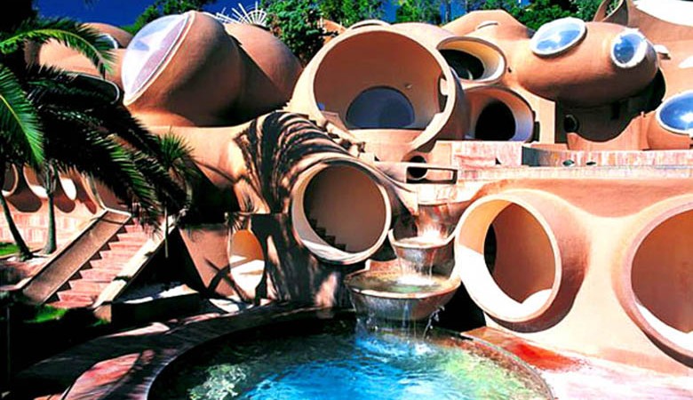 Swimming pool and housing units at the palais bulles, palace of bubbles Pierre Cardin house by antti lovag in Cannes