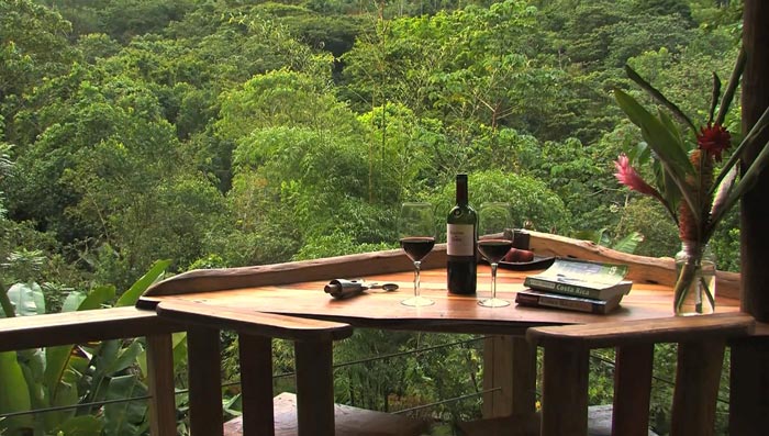 Wooden table and chair at the Finca Bellavista Treehouse Community in Costa Rica