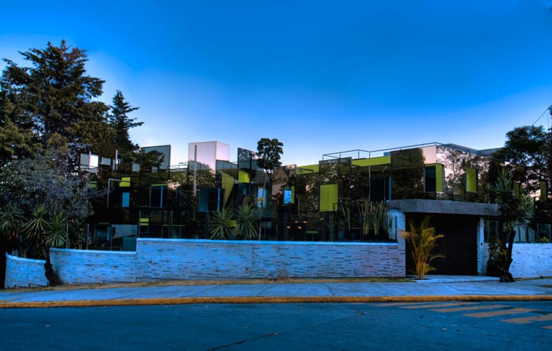Street view of the Trevox 223 Reflective Building by CRAFT Arquitectos