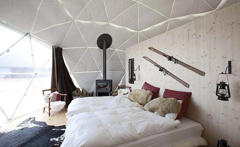 Interior design of a room at the Whitepod Hotel in the Swiss Alps in Switzerland