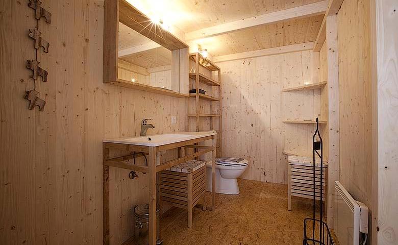 Bathroom with wooden interior design at the Whitepod Hotel in the Swiss Alps in Switzerland