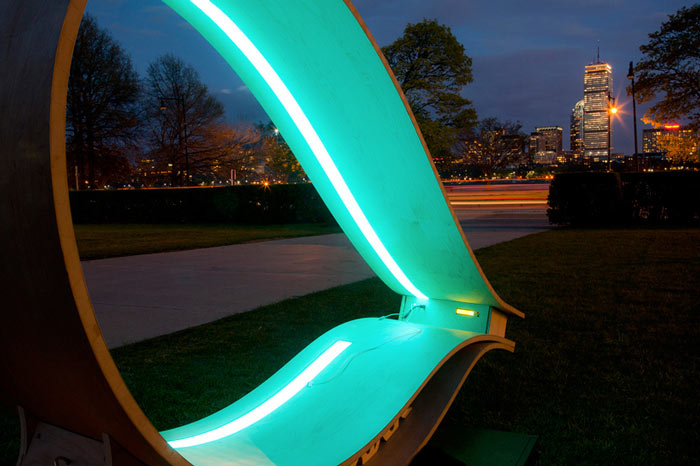 MIT SOFT Rockers Solar Powered Charging Station & Rocking Chair illuminated at night