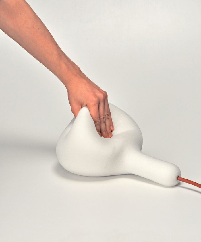 Soft Light Lamp and Pillow by Simon Frambach being squished