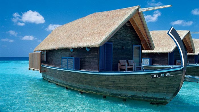 Exterior view of a water bungalow at Cocoa Island Resort in The Maldives by COMO Group