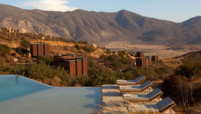 Outdoor swimming pool and lounge chairs at ENCUENTRO GUADALUPE ANTIRESORT IN BAJA CALIFORNIA