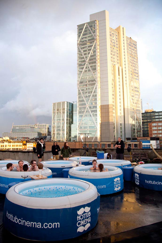 People in Hot Tubs at the Rooftop Cinema at Rockwell House in London during the day
