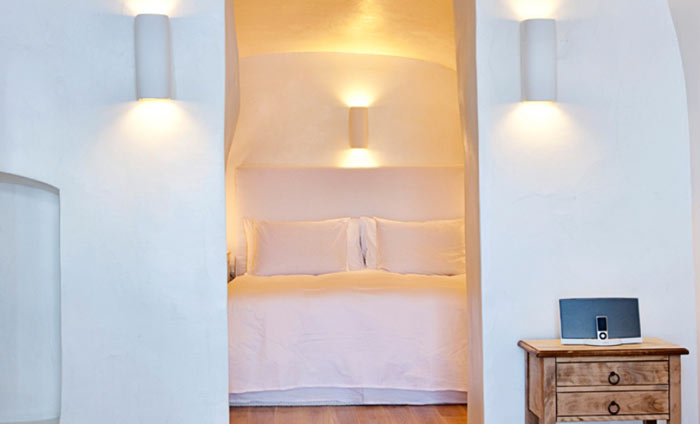 Bed in a room at Katikies Hotel in Santorini