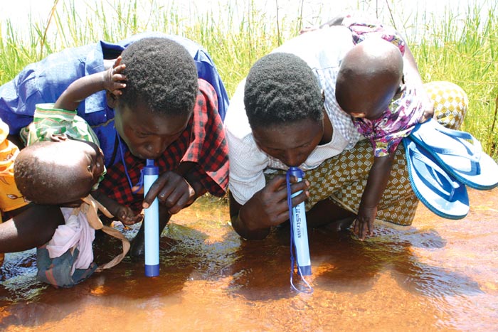 Africans using the Lifestraw Portable Water Filtration System