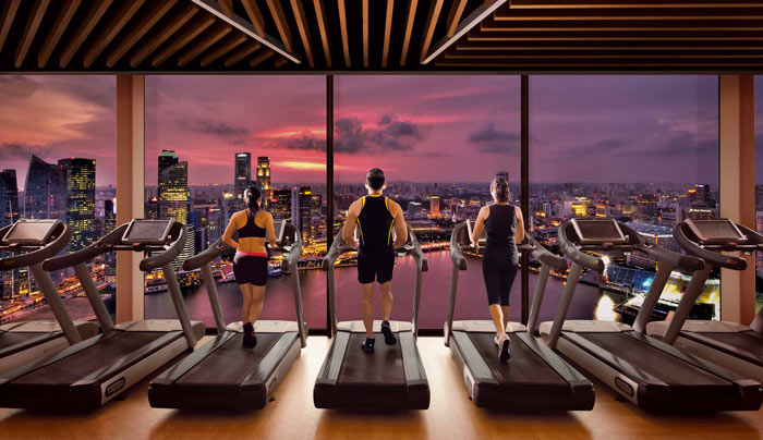 Gym with a view of downtown Singapore at Marina Bay Sands Hotel