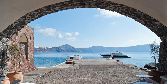 View of the sea and mountains in the horizon at Perivolas Hideaway in Thirassia, Santorini