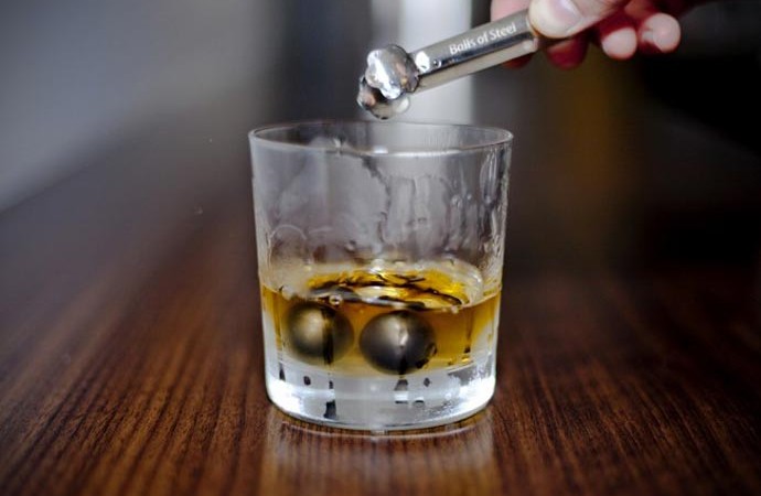 2 balls of steel in a Whiskey glass