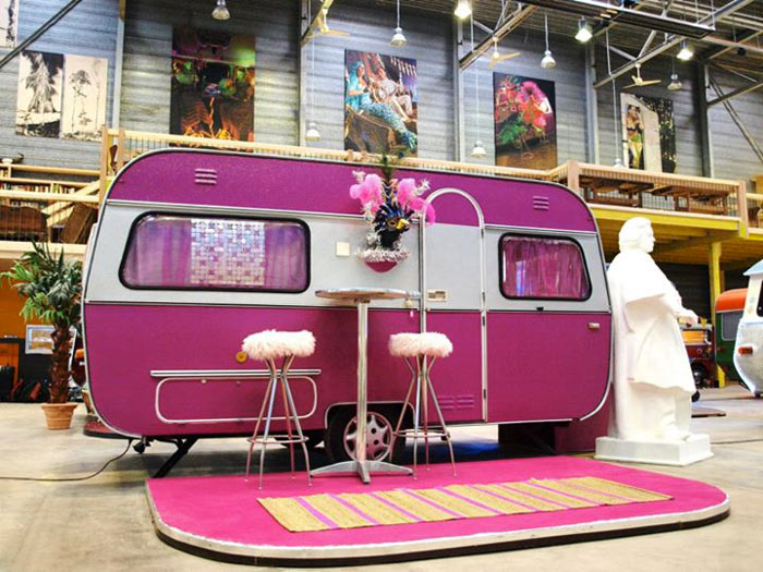 A pink trailer at Basecamp Young Hostel