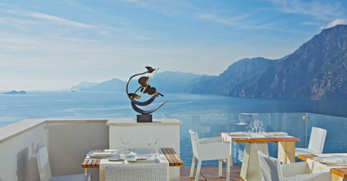 Terrace with table and chairs at CASA ANGELINA IN PRAIANO AMALFI COAST, ITALY