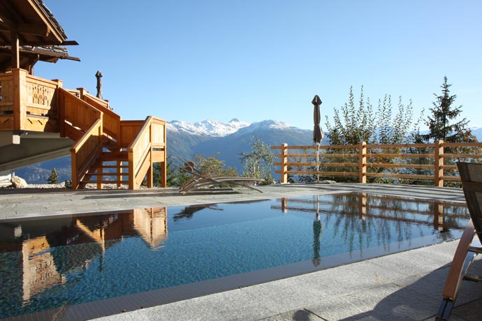 Outdoor pool at LeCrans Hotel & Spa in Switzerland