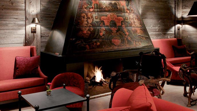 Fireplace at a lounge in LeCrans Hotel & Spa in Switzerland