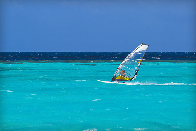 Windsurfing at Maafushivaru Island Resort in the Maldives