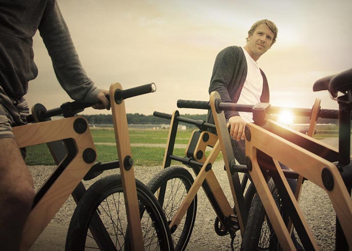 Man using the Sandwichbike Wooden Bicycle