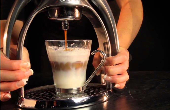 Making espresso with a hand pressed espresso maker