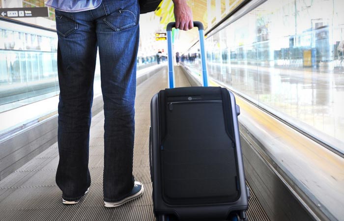 Man using the Bluesmart carry-on bag