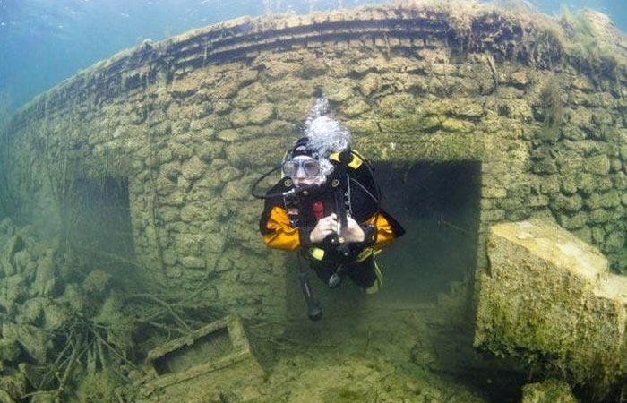 Scuba diver underwater at a prison in Estonia