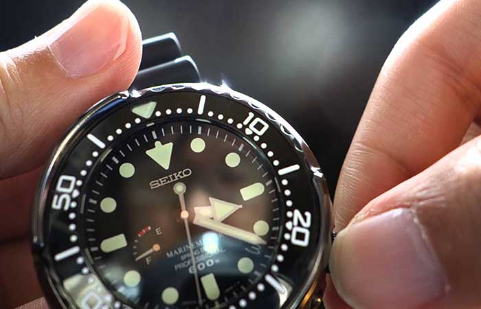 A man setting the time on SBDB009 – Seiko Prospex MarineMaster Spring Drive Diver’s Watch