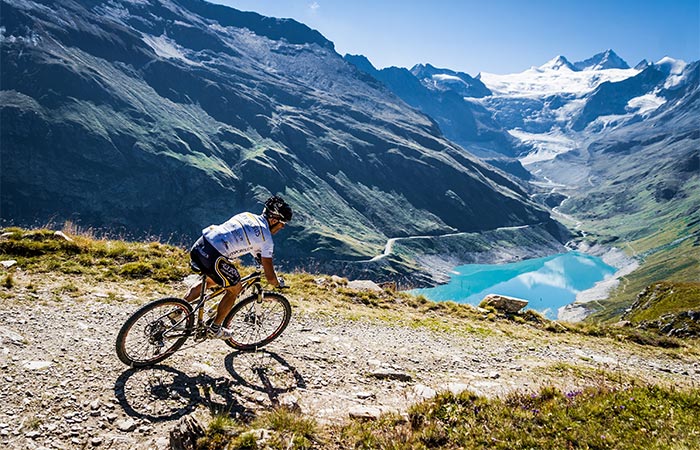 Mountain cycling next to a lake