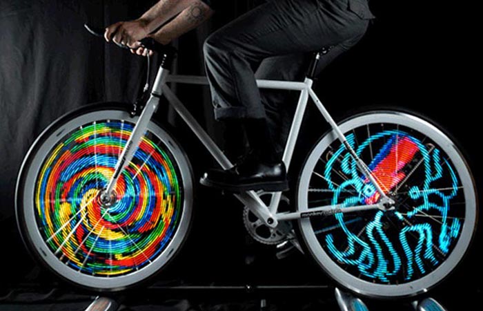 A bicycle with LED Bike Wheel Lights attached to the wheels, ridden, simulation.