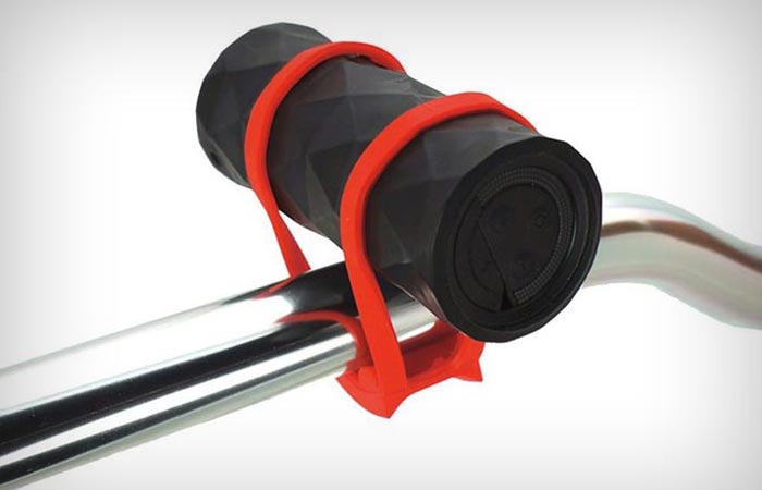 The Buckshot Bicycle speaker attached to a metal pole. White background.