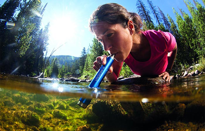 A Girl Drinking Water With LifeStraw Steel