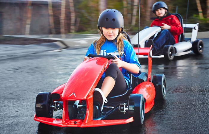 A boy and a girl captured while driving the Smart-Kart.