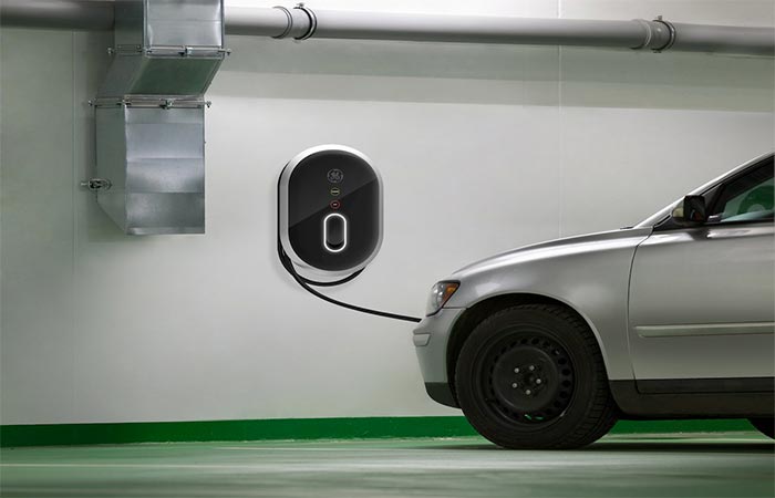 An electric car charging via GE WattStation