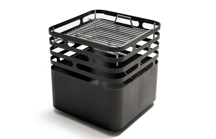 Höfats CUBE Fire Pit with a cooking grate, tilted, on a white background.