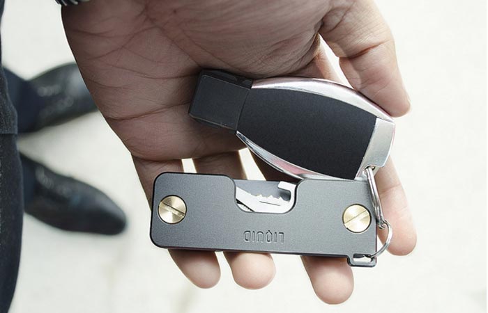 Key Caddy with a car key attached, held in hand.