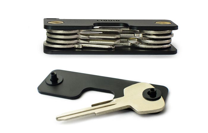 Key Caddy folded, with multiple keys, above, and the bottom part of the base with one key, below, on a white background.