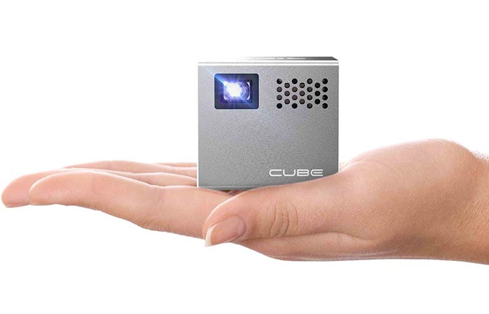 RIF6 Mobile Projector on the palm of a hand with a white background.