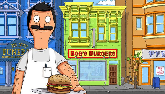 Bob in front of the Bob's Burgers restaurant. 