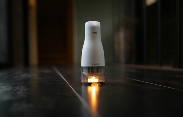 Lumir C Candle Powered LED Lamp Placed On A Surface