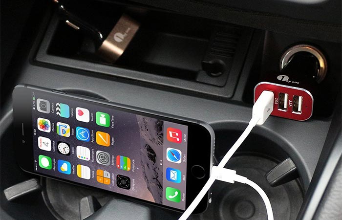 Smartphone Being Charged With 1Byone 7.2A / 36W 3-Port USB Car Charger In The Car