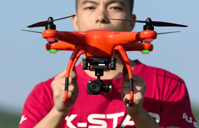 Man holding the X-Star Drone