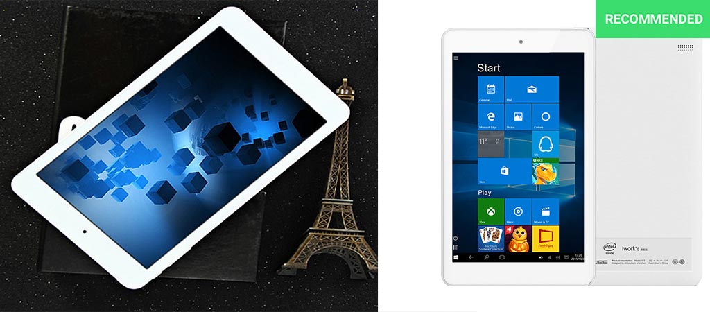 The Cube iWork8 Ultimate tablet on a book and next to a small Eiffel Tower and with a white background