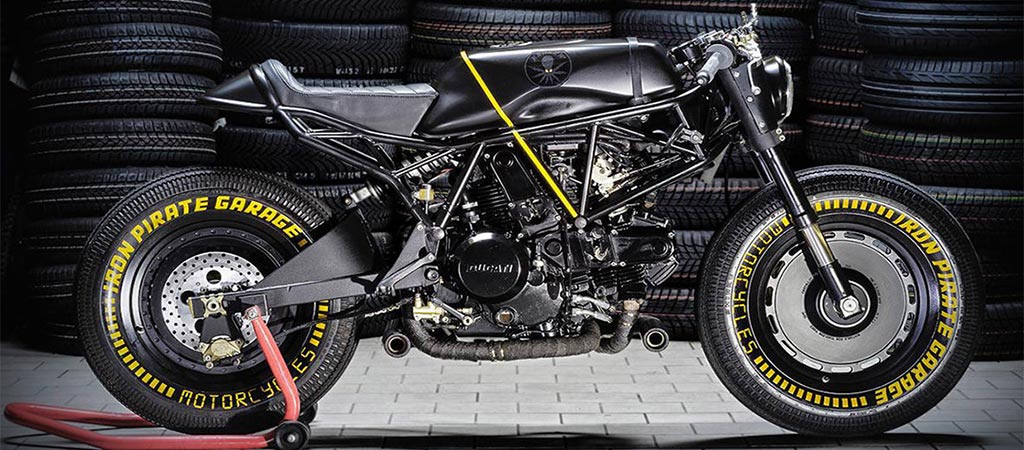 Ducati SS 750 Kraken by Iron Pirate Garage in front of tires