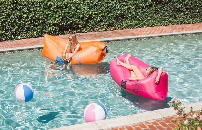 Girls using the Chillbo Baggins in a pool.