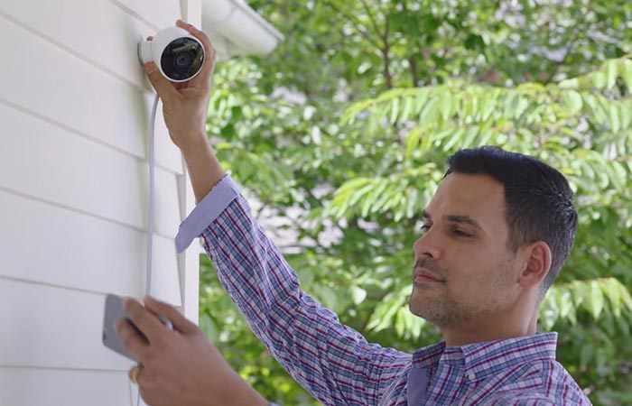 Guy installing the Nest Cam Outdoor