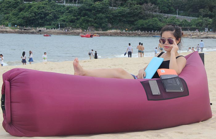 Girl using a purple BonClare inflatable lounger