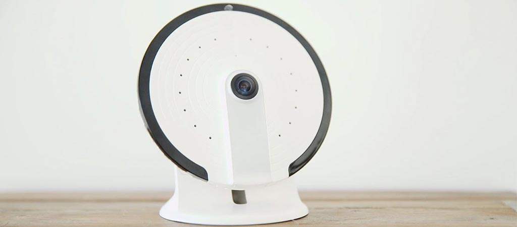 White smanos UFO security camera on a stand