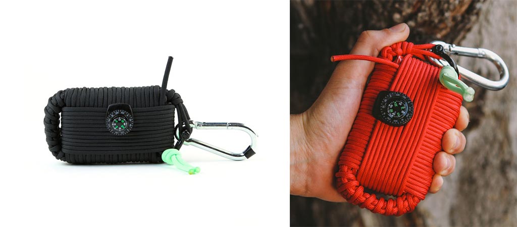 Survival Grenade with black Paracord and another being held by someone with red Paracord